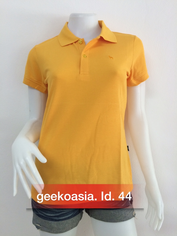เสื้อโปโลผู้หญิงสีเหลืองทอง